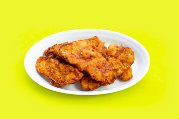 Fried bananas on green background.