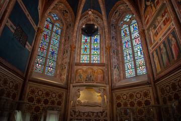 Assisi Italy 2022Faithful visiting the lower basilica of San Francesco d'Assisi, beautifully frescoed by some of the greatest artists of the Italian fourteenth century