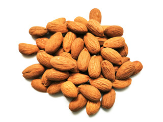 Obraz premium Golden almonds on the white background. Closeup of whole raw almonds