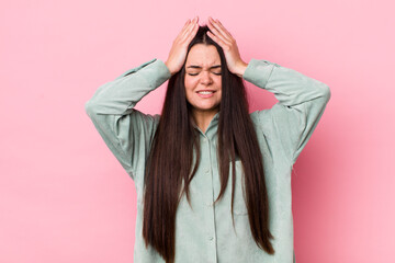 young adult woman feeling stressed and anxious, depressed and frustrated with a headache, raising both hands to head - obrazy, fototapety, plakaty