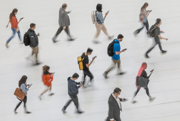 Blur of focus, people in the lobby of a public building