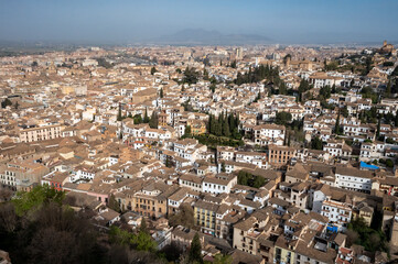 Fototapeta na wymiar Aerial panoramic view on buildings, old district, mountains and palace, world heritage city Granada, Andalusia, Spain