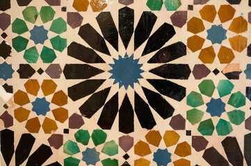 Ornamental medieval ceramic tiles of walls in Nasrid Palaces in the Alhambra palace Granada, Andalusia, Spain