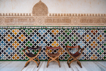 Fototapeta premium Ornamental medieval ceramic tiles of walls in Nasrid Palaces in the Alhambra palace Granada, Andalusia, Spain