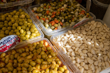 Assortment of pickled green olives on farmers market in Malaga, Andalusia, Spain