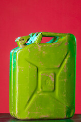 green fuel container on colorful bright backgrounds isolated close-up with blank space for title...