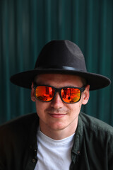 Smiling fashion man. Portrait of handsome smiling stylish hipster lambersexual model. Man dressed...
