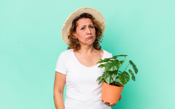 middle age woman feeling sad and whiney with an unhappy look and crying. gardering concept