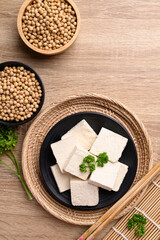Homemade tofu with soybean seed, Vegan food ingredients in Asian cuisine, Plant based, Table top view