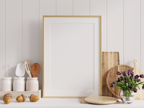 Mock up poster frame in kitchen interior with white wall.