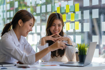 two successful business women working together in the office