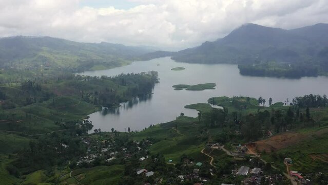 A town among tea plantations and a lake in the mountains. Maskeliya, Maussakelle reservior, Sri Lanka.