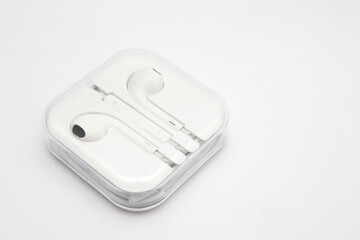 White wired headphones in the case