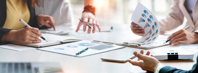 diverse coworkers working together in boardroom, brainstorming, discussing and analyzing and planning business strategy. - obrazy, fototapety, plakaty