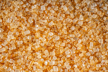 Raw Unrefined Brown Sugar in the Raw Form Top View Flat Lay Extreme Macro Texture Background