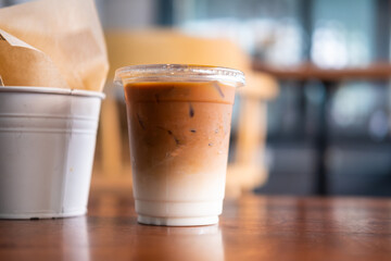 Iced coffee latte on wooden table.