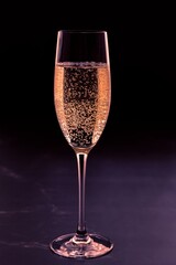 Glass of champagne on dark background
