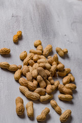 Vertical photo of Arachis hypogaea, peanuts in shell.