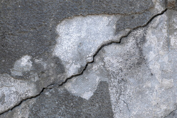 deep cracks and poured plasters on concrete wall