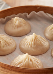 Xiaolong soup dumplings in a steamer