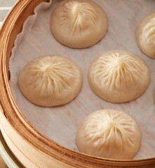 Xiaolong soup dumplings in a steamer