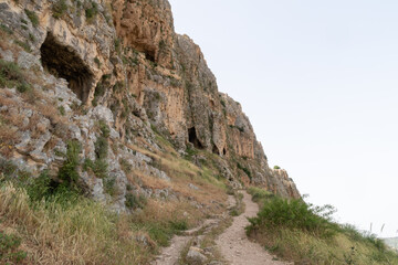 The remains  of the buildings of the ancient settlement on Mount Arbel, located on the coast of Lake Kinneret - the Sea of Galilee, near the city of Tiberias, in northern Israel