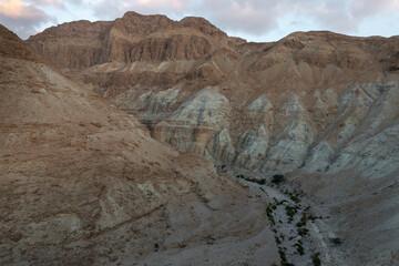 View  at dawn of mountains of stone desert near the Khatsatson stream on the Israeli side of the Dead Sea near Jerusalem in Israel