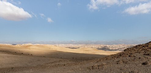 Fototapeta na wymiar Stone desert near the Khatsatson stream, on the Israeli side of the Dead Sea, near Jerusalem in Israel