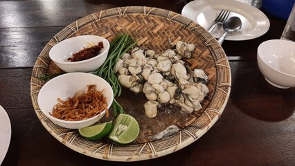 Fresh oyster and lemon Thai style in Thai restaurant