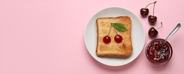 Bowl of sweet cherry jam and toasted bread on pink background with space for text