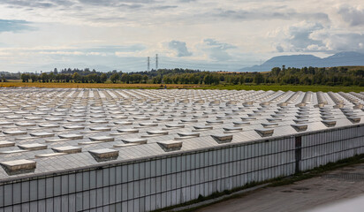 Glass greenhouses from above. Greenery. Contemporary technologies. Modern large commercial greenhouse construction