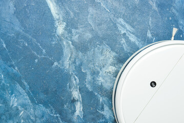 Robot vacuum cleaner on color background, closeup