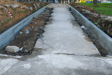  Installation of concrete curbs during road to home construction.  Renovation concept.