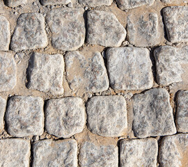Stone paving stones as an abstract background.