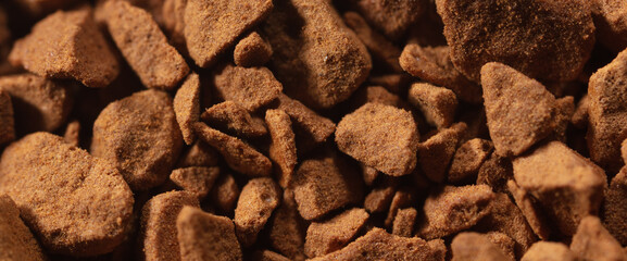 Instant coffee granules as background.