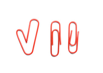 Red paper clips on white background