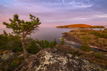 Stone islands on the lake on a sunny summer morning