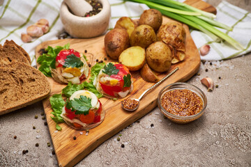 Portion of delicious chicken aspic on serving board on concrete table
