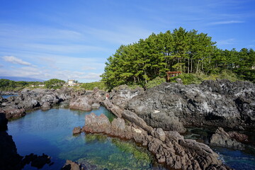 gazebo at seaside cliff, with clear water