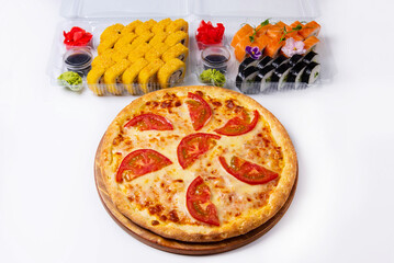 set. pizza margarita and Japanese rolls, sushi. on a white background