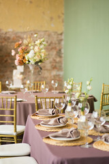 festive wedding table with glasses, napkins and plates