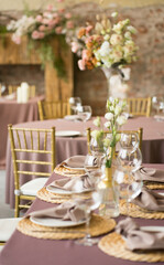 festive wedding table with glasses, napkins and plates