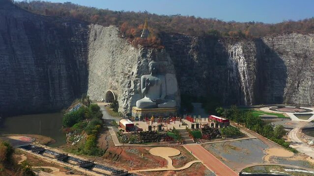 Aerial view of Luang Pho U Thong or Phra Phuttha Pusaya Khiri Sri Suvarnabhumi, Bhutsaya Khiri Suvarnabhumi, also known as Rock Buddha in Suphan Buri, Thailand