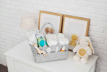 Mothers bag with toy and accessories on white background