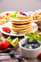 stack of pancakes with berries fruits