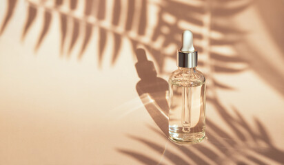 serum on beige background with natural shadow	
