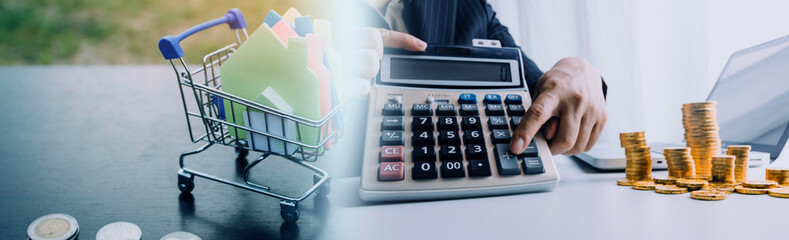 businessman working on desk office with using a calculator to calculate the numbers, finance accounting concept