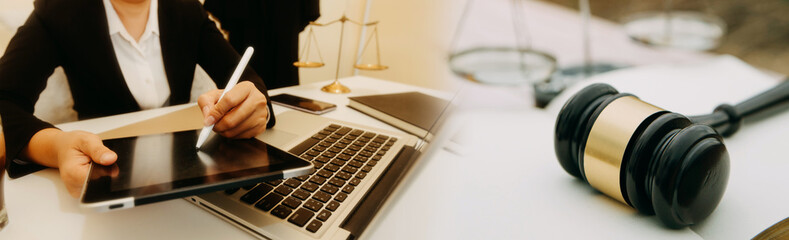 Business and lawyers discussing contract papers with brass scale on desk in office. Law, legal services, advice, justice and law concept picture with film grain effect