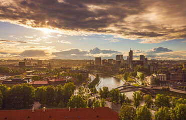 Rain over Vilnius with skyscrapers, colorful evening view of Vilnius with rain, capital of Lithuania