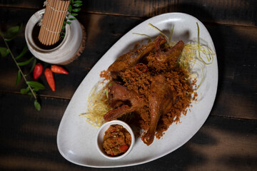 Duck with Fried Coconut Flakes or Bebek Serundeng is an Indonesia popular dish and delicious taste which is found in every restaurant in Indonesia.